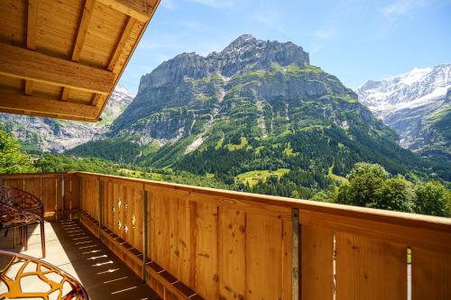 a balcony with a view of a mountain at Boutique Hotel Panorama Grindelwald in Grindelwald