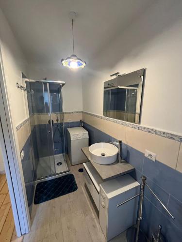 a bathroom with a toilet sink and a shower at La casa di Iole in Maratea
