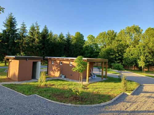 a building with a pavilion in a park at Eko Kamp odmorište Brig in Duga Resa