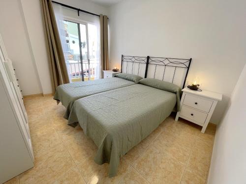 Ένα ή περισσότερα κρεβάτια σε δωμάτιο στο Edificio Don Diego