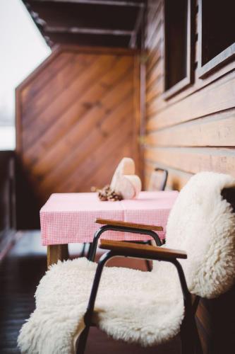 a room with a table and a chair with a table at Alpenhaus Monte in Neustift im Stubaital