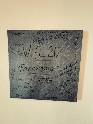 a piece of paper with writing on a wall at Apartmány Panorama Harrachov in Harrachov