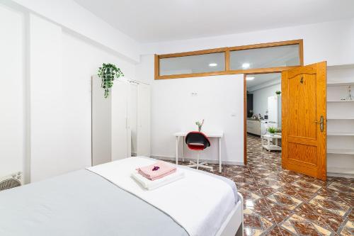 En eller flere senge i et værelse på Casa Maruchi Apartamento 2