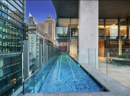 a swimming pool in the middle of a building at Stylish 2 Bed in Central CBD with Pool & Gym in Sydney