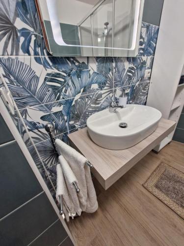 a bathroom with a sink and a mirror at Medea in Syracuse