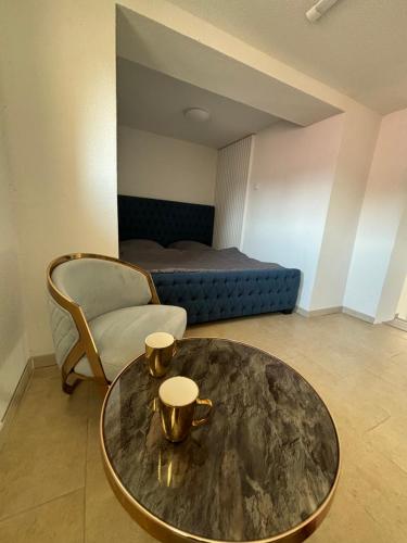 a living room with a table and a bed at Sebe apartments 4 in Holíč