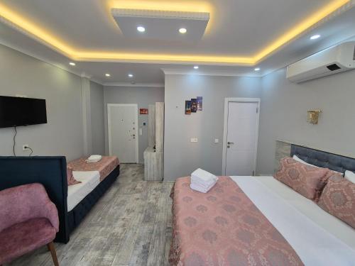 Ένα ή περισσότερα κρεβάτια σε δωμάτιο στο VERSECA HOTEL