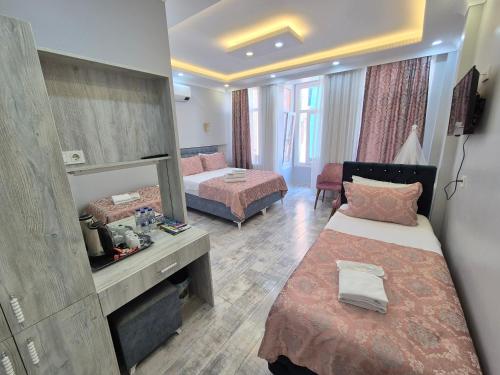 Ένα ή περισσότερα κρεβάτια σε δωμάτιο στο VERSECA HOTEL