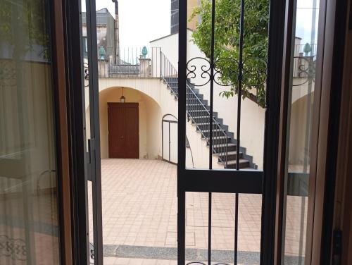 a view of a staircase from a glass door at Grace's House in Acireale