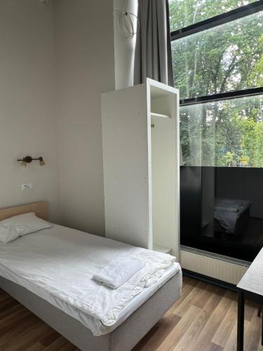 Ένα ή περισσότερα κρεβάτια σε δωμάτιο στο THH Apartments