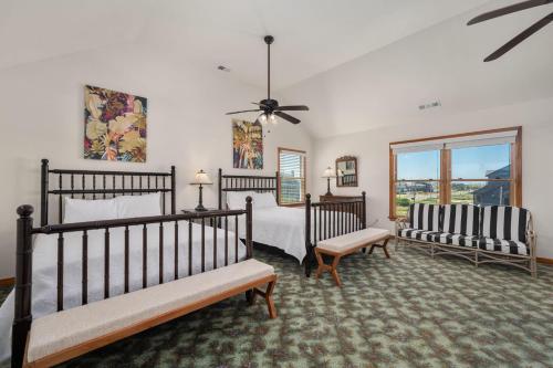 a bedroom with two beds and a window at NH340 Gillam Hall in Nags Head