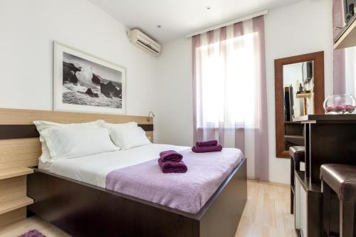 Apartments Aspalathos tesisinde bir odada yatak veya yataklar