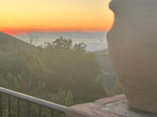 a view of the ocean at sunset from a balcony at Antica Dimora in Trentinara