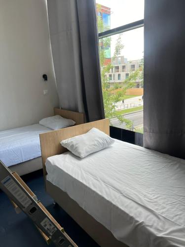 Ένα ή περισσότερα κρεβάτια σε δωμάτιο στο THH Apartments