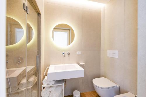 a bathroom with a sink and a toilet at La Nuvola in Chieti