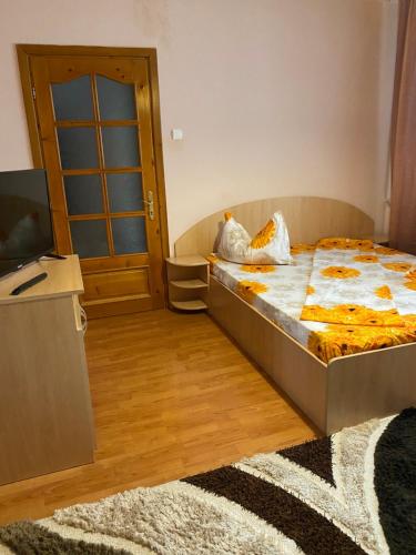 Ένα ή περισσότερα κρεβάτια σε δωμάτιο στο Apartament Darya