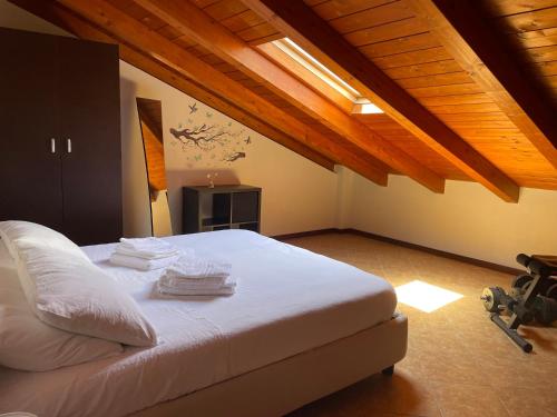 a bedroom with a bed with towels on it at Messina Skyline in Messina