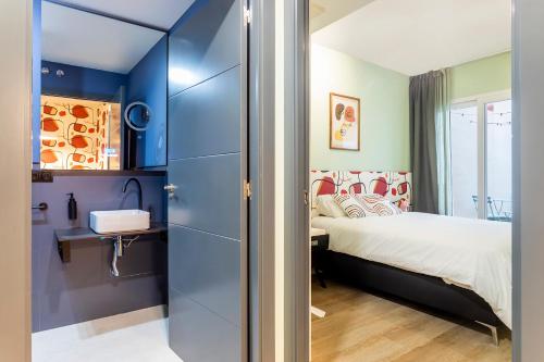 Ένα ή περισσότερα κρεβάτια σε δωμάτιο στο Apartamento B Cube by Mimood Aparthotels