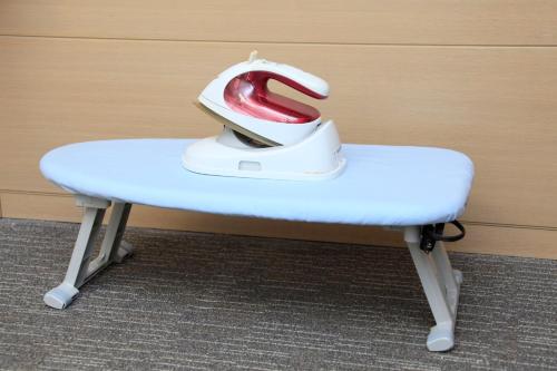 a shoe sitting on top of a stool at Richmond Hotel Premier Musashikosugi in Kawasaki