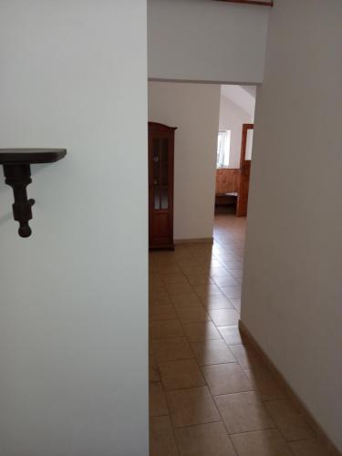 a hallway with a table and a tile floor at Privát Střelnice in Česká Lípa