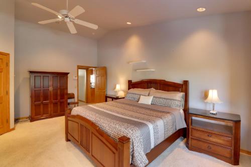a bedroom with a bed and a ceiling fan at Patio and Forest View Peaceful Show Low Home in Show Low