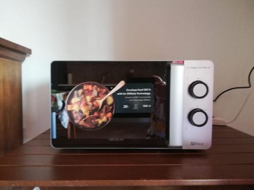 a tablet on a table next to a wii controller at Gli Ulivi in Budoni
