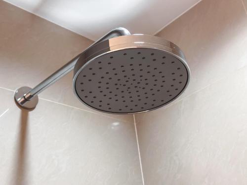 a shower head on the ceiling of a bathroom at Chez Moi Bangkok Private Executive Residence Sukhumvit 26 in Khlong Toei