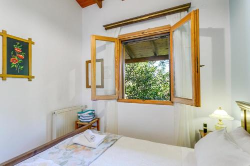 Postel nebo postele na pokoji v ubytování Agapi Villa