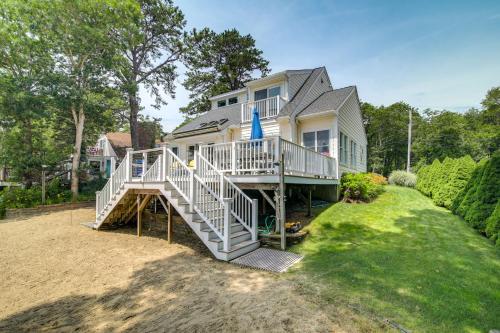 a large house with a staircase leading up to it at Plymouth Getaway with Private Lake Beach and Kayaks! in Plymouth