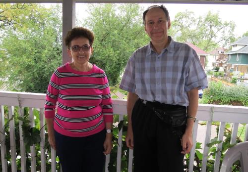 an older man and woman standing on a porch at Rainbow Bed & Breakfast in Niagara Falls