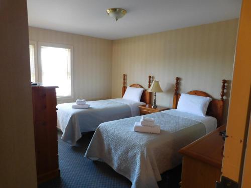 Katil atau katil-katil dalam bilik di Rainbow Bed & Breakfast