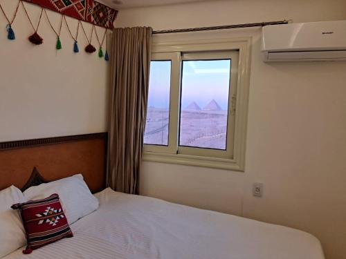 Atlantis Pyramids Innにあるベッド