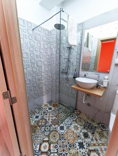 a bathroom with a shower and a sink at Easy Apartments in Kumanovo