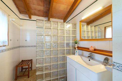 a bathroom with a sink and a mirror at Hermosa Finca Padre in Son Servera