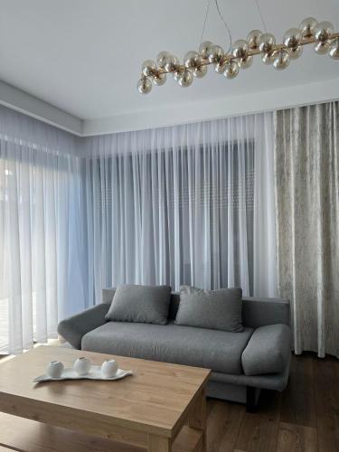 a living room with a couch and a table at Apartament Korczyńskiego 29 in Zakliczyn