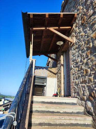 a set of stairs leading up to a stone building at Agriturismo Il Borgo della Canapa in San Benedetto