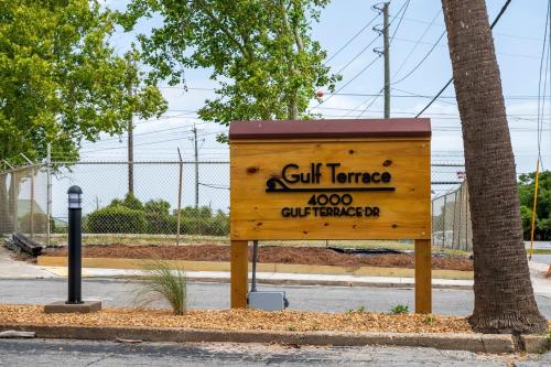 a wooden sign on the side of a street at Catching Rays 3 Comm Pools Family & Pet friendly in Destin