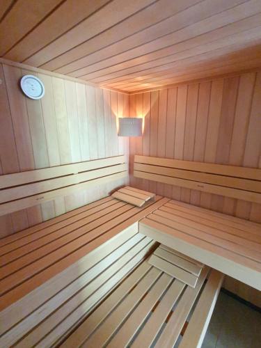 a sauna with a bench and a lamp in it at Ferienhaus Schellgaden in Muhr
