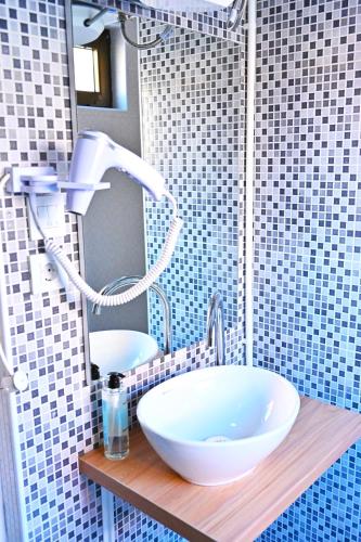 a bathroom with a white sink and a mirror at Easy Apartments in Kumanovo
