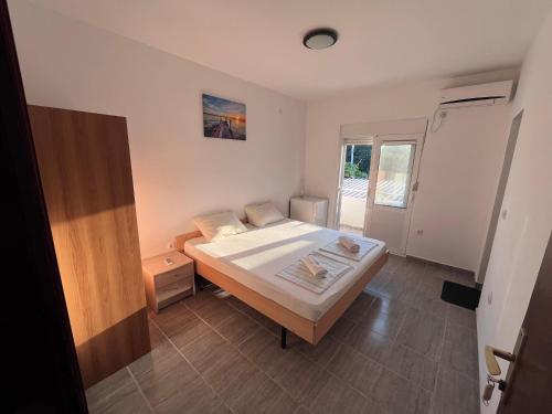 Postel nebo postele na pokoji v ubytování Saraj appartments