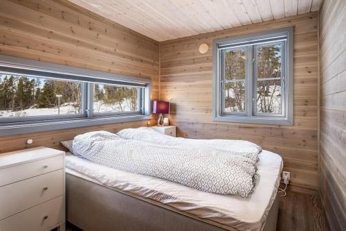 Ένα ή περισσότερα κρεβάτια σε δωμάτιο στο The cabin at Lemonsjøen Jotunheimen