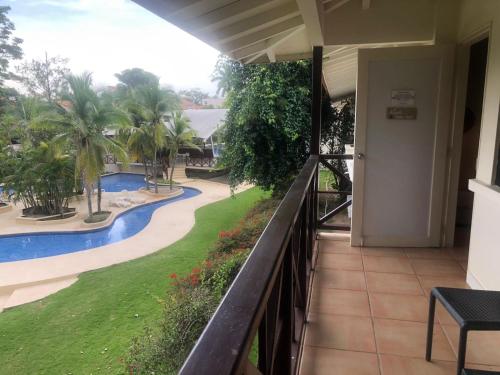 a balcony with a view of a swimming pool at Playa Coronado - Suite Privada en Hotel Coronado Luxury Club & Suites in Chame