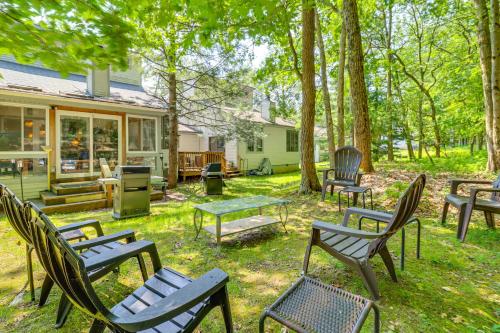 a group of chairs and tables in a yard at Walk to Restaurants Lake Harmony Townhome! in Lake Harmony