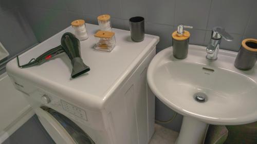 a bathroom with a sink and a white sink at Amazing View Of Acropolis in Athens