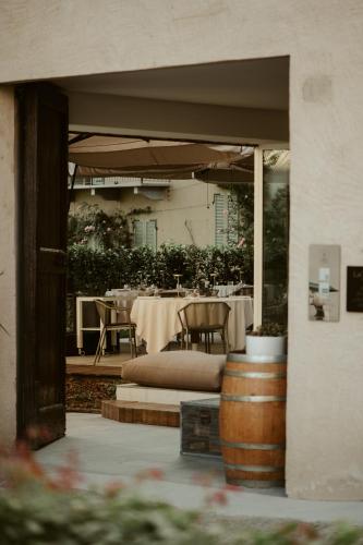 an outdoor patio with a table and chairs and a table set up at Palas Cerequio in La Morra