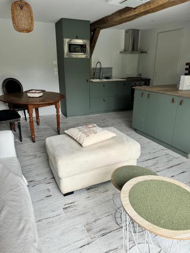 a living room with a couch and a table at Maison Au coeur d'Amboise in Amboise