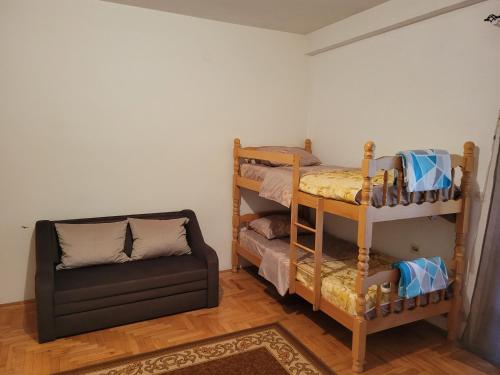a room with two bunk beds and a chair at Studio Ohrid Pearl in Ohrid