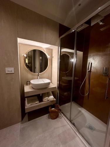 a bathroom with a sink and a shower at DIMORA BELLAVISTA in Bitonto