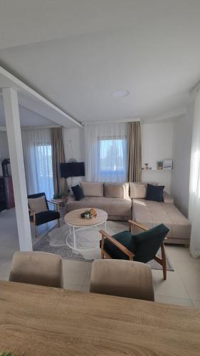a living room with a couch and a table at Golija Simovic home in Radaljica