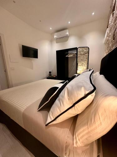 a bedroom with a bed with two pillows on it at DIMORA BELLAVISTA in Bitonto